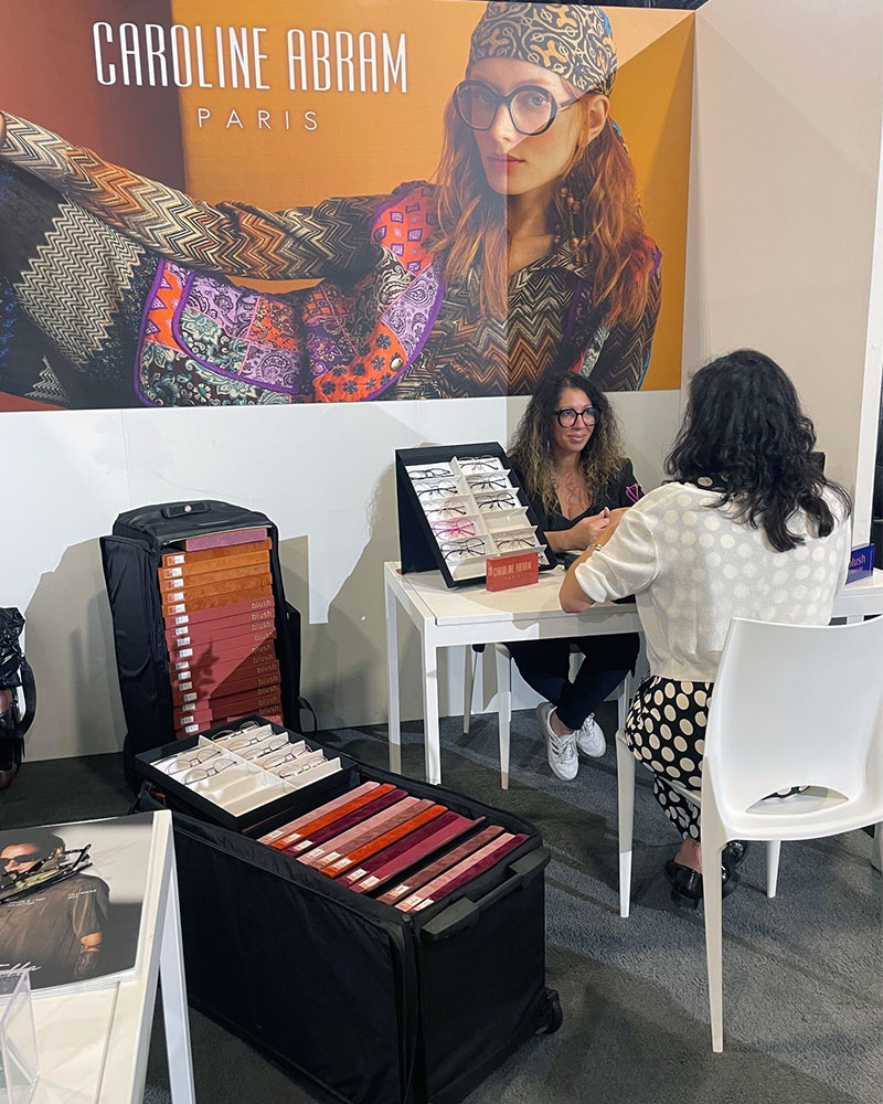 Photo of Caroline Abram Manager Using Bag PRO sample bags at an optic fair