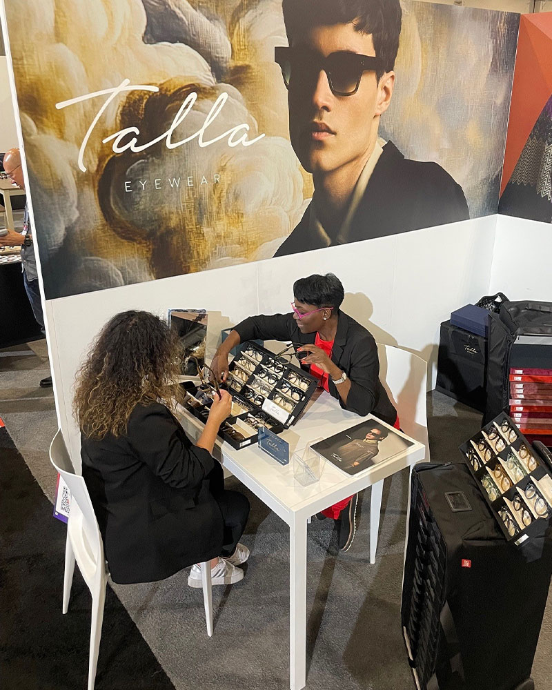Teresa, sales rep for Talla, using Bag PRO's gear during Vision Expo 2025